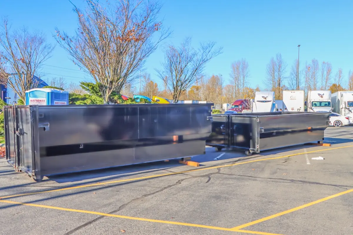 Professional dumpster rental service with roll-off container on residential driveway in Hawthorn Woods